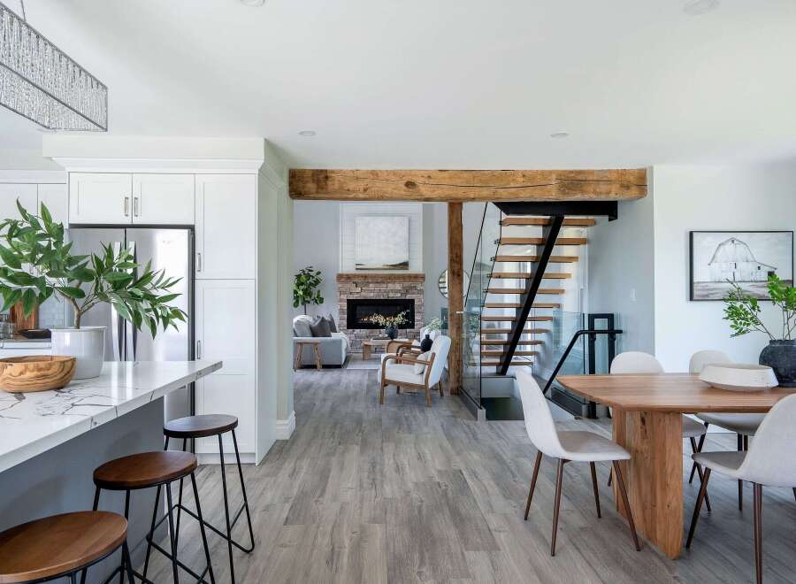 Step into luxury with this stunning open-concept home! Featuring a modern kitchen with a sleek island and stylish seating, this property is perfect for entertaining.
