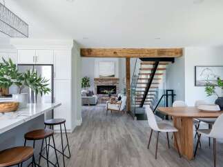 Step into luxury with this stunning open-concept home! Featuring a modern kitchen with a sleek island and stylish seating, this property is perfect for entertaining.