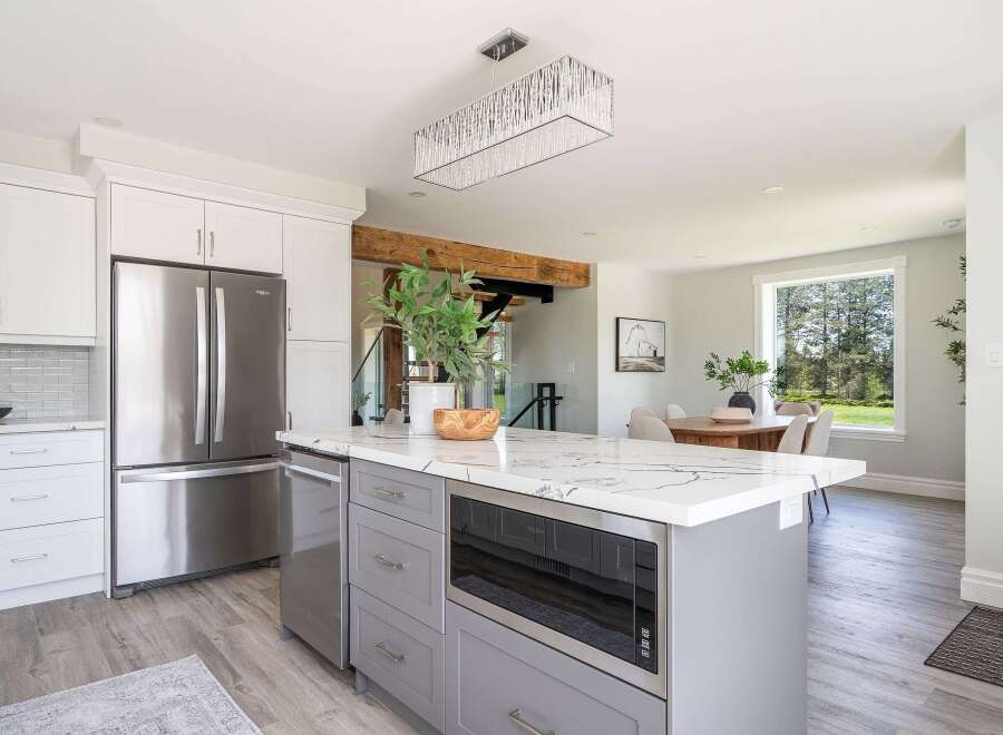 This stunning kitchen boasts a modern design with sleek cabinetry and stainless steel appliances.