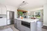 This stunning kitchen boasts a modern design with sleek cabinetry and stainless steel appliances.