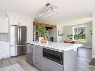 This stunning kitchen boasts a modern design with sleek cabinetry and stainless steel appliances.