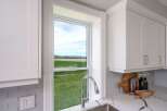 This stunning kitchen boasts a bright and airy feel, perfect for culinary enthusiasts.