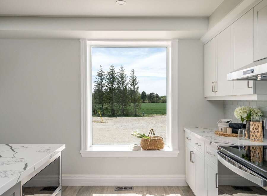 This stunning kitchen boasts a bright and airy atmosphere, perfect for culinary creations.