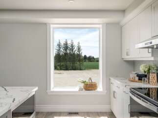 This stunning kitchen boasts a bright and airy atmosphere, perfect for culinary creations.