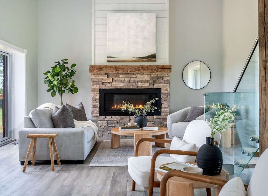 Step into luxury with this stunning living room, featuring a cozy fireplace and elegant decor.
