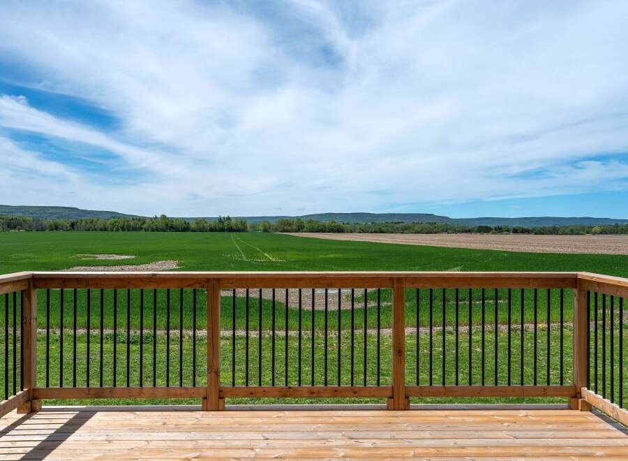 Enjoy breathtaking views from this stunning property! This home features a spacious deck, perfect for relaxing and entertaining.