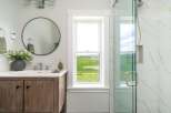 This stunning bathroom boasts a modern design with a touch of nature.