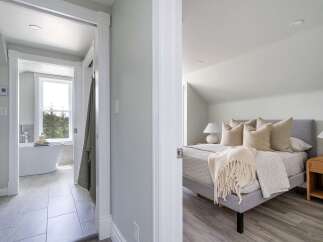 Step into luxury with this stunning property, featuring a beautifully designed bedroom and a spa-like bathroom.