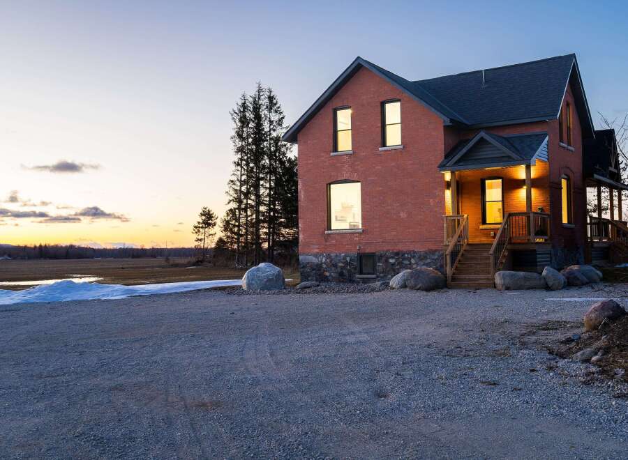 This stunning brick home offers a blend of classic charm and modern comfort.