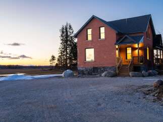 This stunning brick home offers a blend of classic charm and modern comfort.