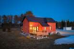 This stunning brick home offers a perfect blend of modern design and natural surroundings.