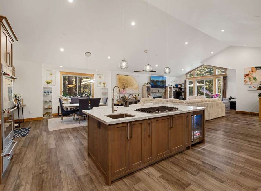 This stunning open-concept home boasts a gourmet kitchen with a large island, perfect for entertaining.