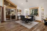 Step into luxury with this stunning dining room, featuring a modern design and ample natural light.