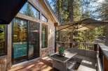 Enjoy the tranquility of this stunning cabin with a beautiful deck overlooking a lush forest.