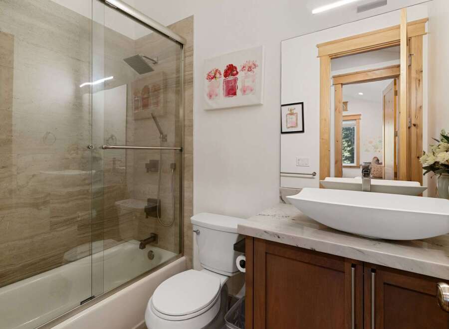 This stunning bathroom boasts a modern design with luxurious features.
