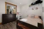 This charming bedroom offers a cozy retreat with its inviting ambiance and stylish decor.