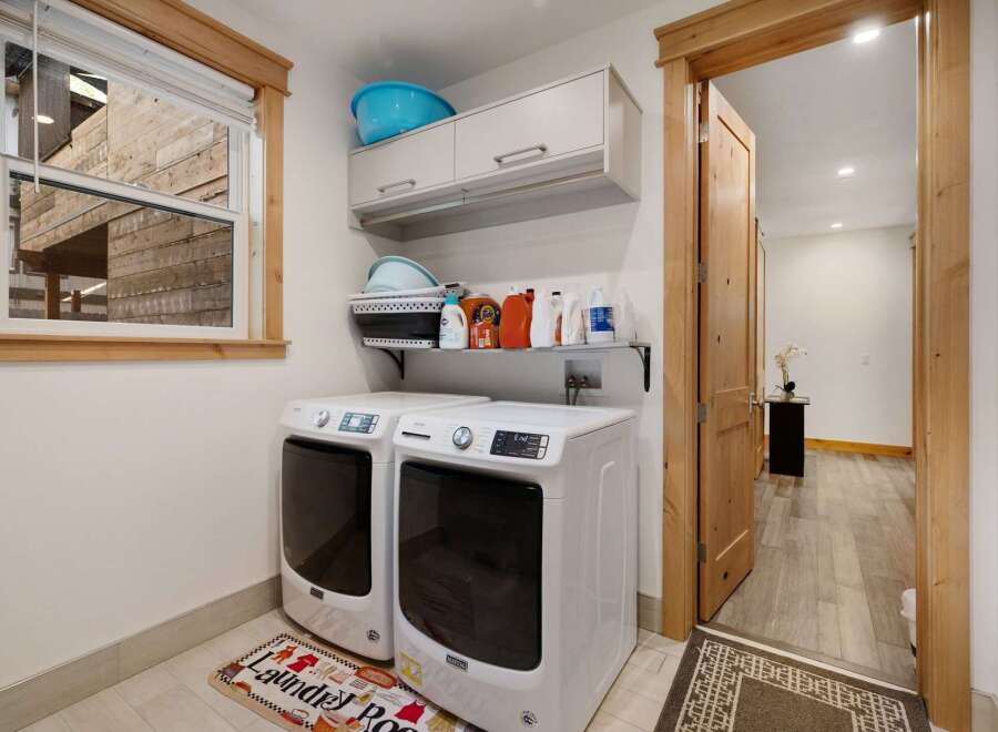Step into this beautifully designed laundry room, a perfect blend of functionality and style.