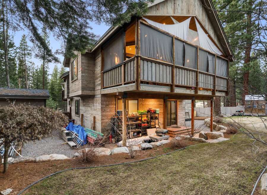 Nestled in a serene wooded setting, this stunning property boasts a unique architectural design with a multi-level structure.