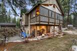 Nestled in a serene wooded setting, this stunning property boasts a unique architectural design with a multi-level structure.