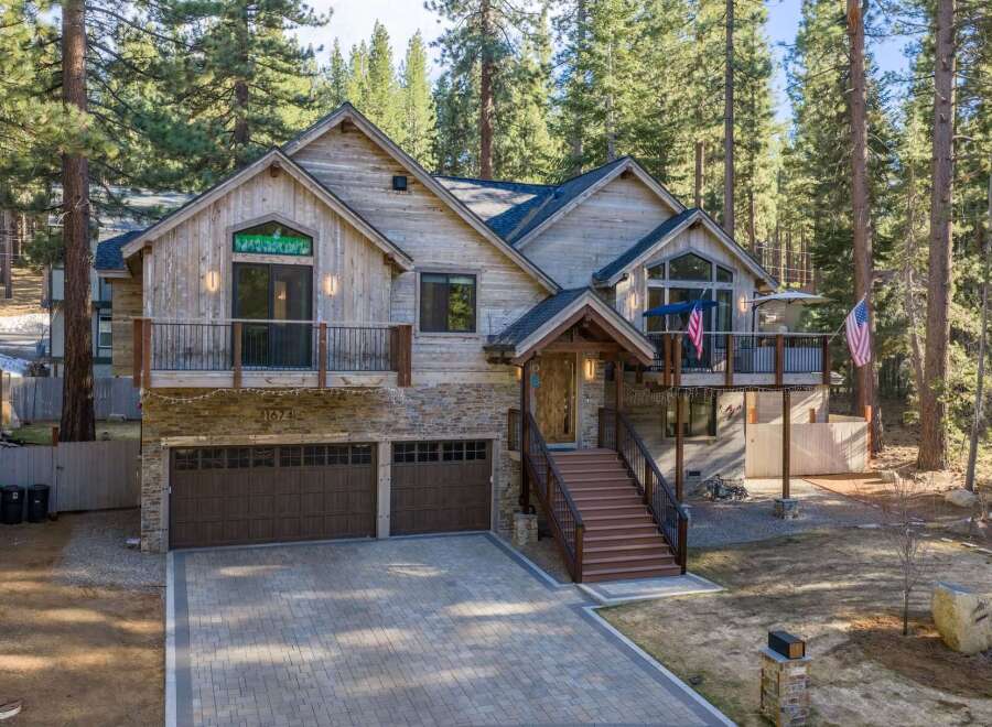This stunning mountain home offers a blend of rustic charm and modern elegance.