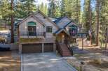 This stunning mountain home offers a blend of rustic charm and modern elegance.