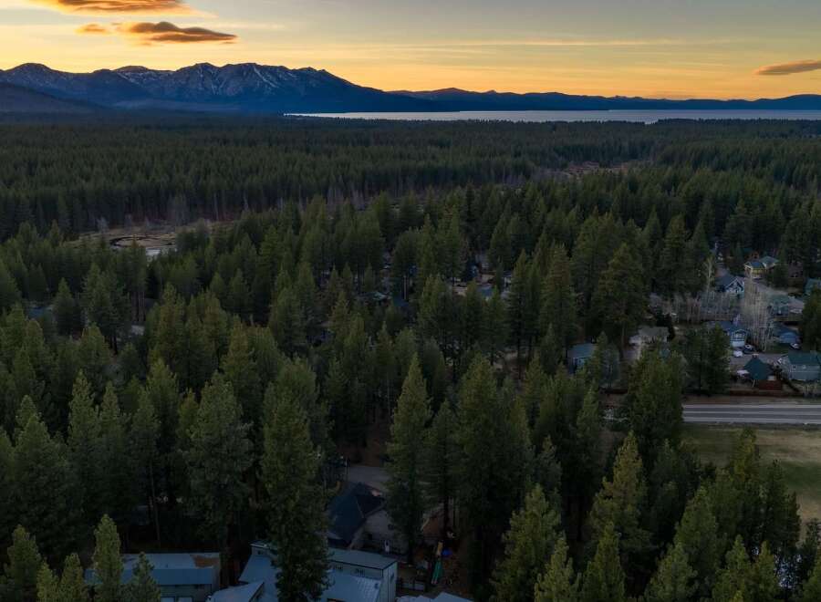 Discover a stunning property nestled amidst a lush forest with breathtaking mountain views.