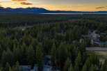 Discover a stunning property nestled amidst a lush forest with breathtaking mountain views.