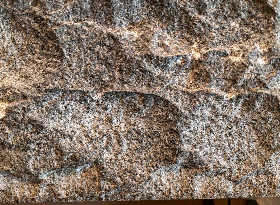 This stunning property boasts a unique stone facade, adding a touch of natural elegance.