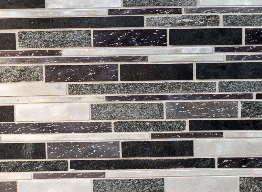 This stunning property boasts a modern design with a beautiful mosaic tile backsplash.
