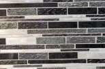 This stunning property boasts a modern design with a beautiful mosaic tile backsplash.