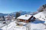 Nestled in a picturesque winter wonderland, this stunning property offers a serene escape.
