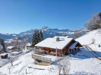 Nestled in a picturesque winter wonderland, this stunning property offers a serene escape.
