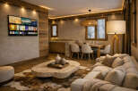 Experience luxury living in this stunning property, featuring a cozy living room with a plush sofa and a unique stone coffee table.