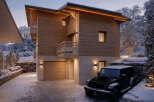 This stunning chalet-style home offers a perfect blend of modern design and natural beauty.