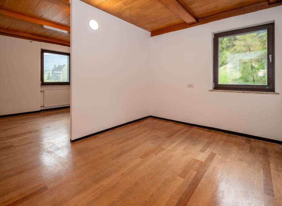 Discover this bright and airy space featuring beautiful wooden floors and a warm, inviting wooden ceiling.