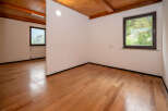 Discover this bright and airy space featuring beautiful wooden floors and a warm, inviting wooden ceiling.