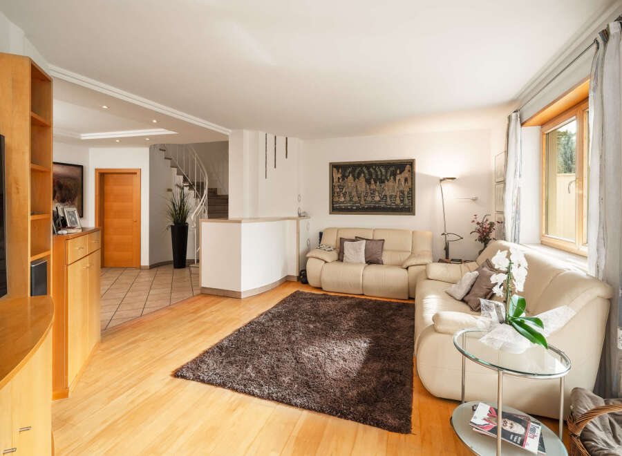 Step into luxury with this stunning living room, featuring a modern design and ample natural light.