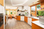 This stunning kitchen boasts a bright and airy design, perfect for culinary enthusiasts.