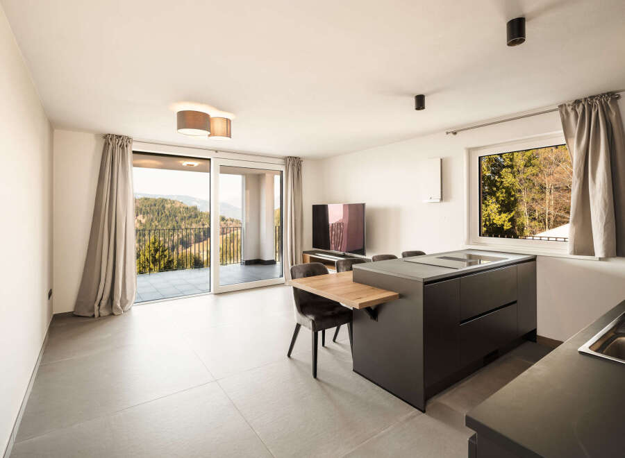 This modern living space boasts stunning views and contemporary design.