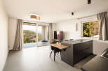 This modern living space boasts stunning views and contemporary design.