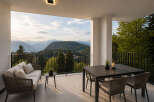 Experience breathtaking mountain views from this stunning outdoor terrace.
