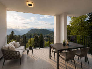 Experience breathtaking mountain views from this stunning outdoor terrace.