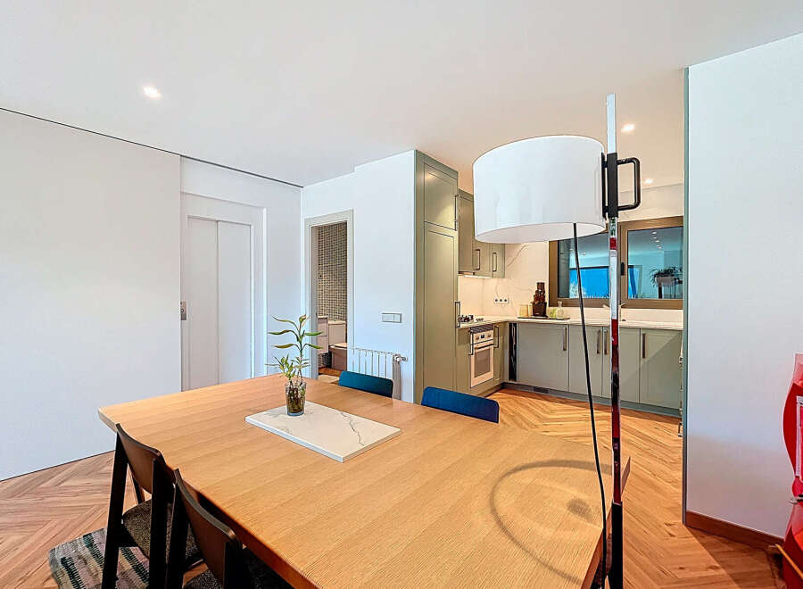 This stunning property boasts a modern kitchen with sleek cabinetry and high-end appliances, perfect for culinary enthusiasts.