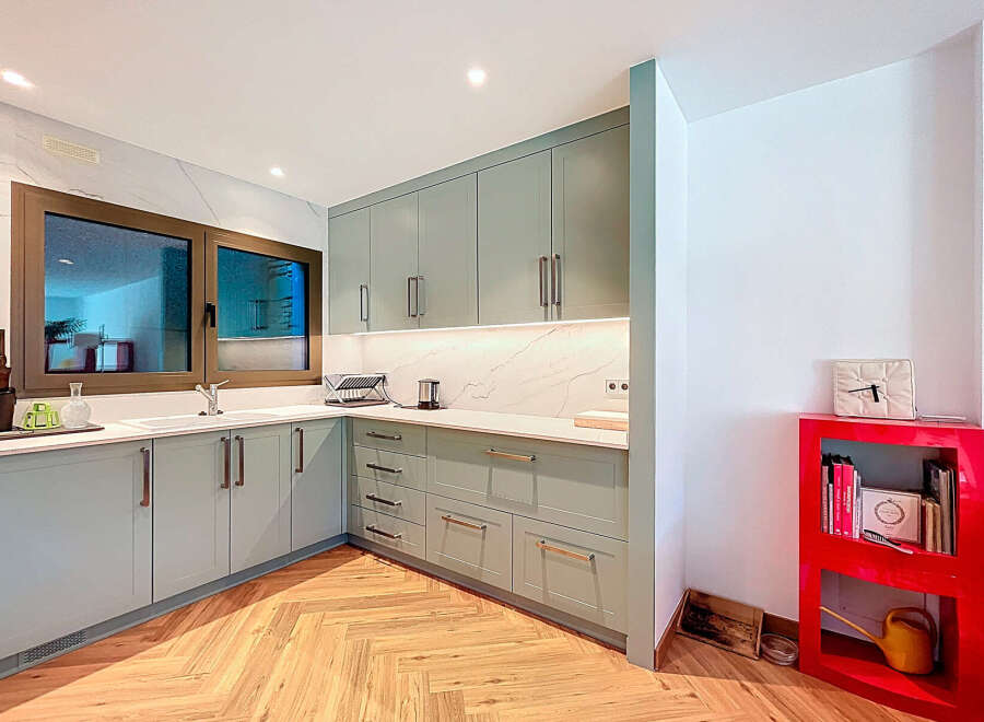 This stunning kitchen boasts modern design with sleek cabinetry and ample counter space, perfect for culinary enthusiasts.