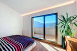 Experience breathtaking mountain views from this stunning bedroom.