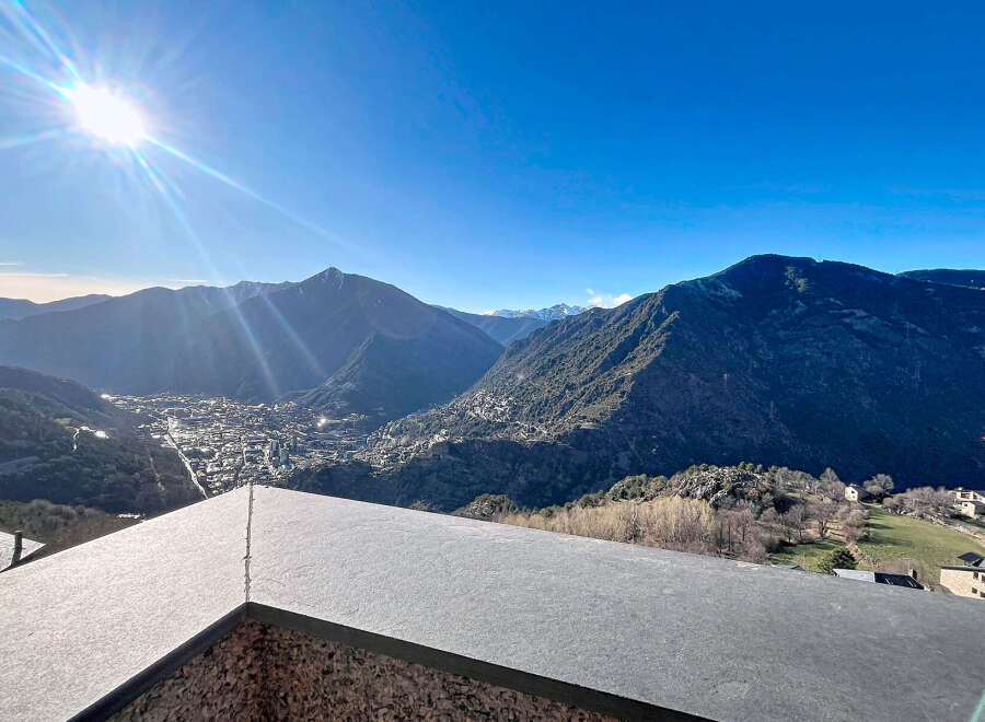 Experience breathtaking views from this stunning property nestled in the mountains.