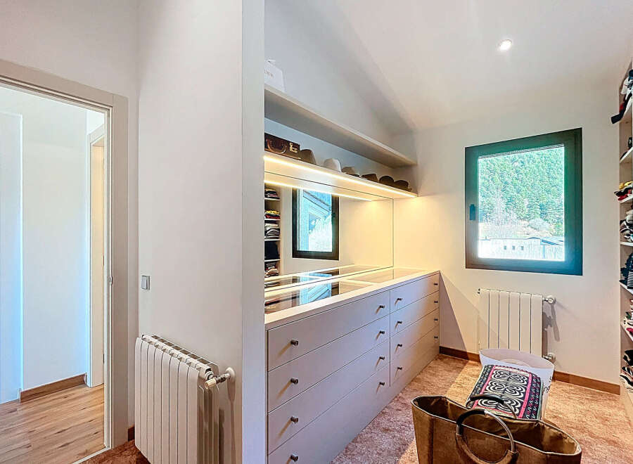Step into luxury with this stunning walk-in closet, designed for both style and functionality.