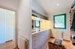 Step into luxury with this stunning walk-in closet, designed for both style and functionality.