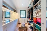 Step into luxury with this meticulously designed walk-in closet, offering ample storage and organization.