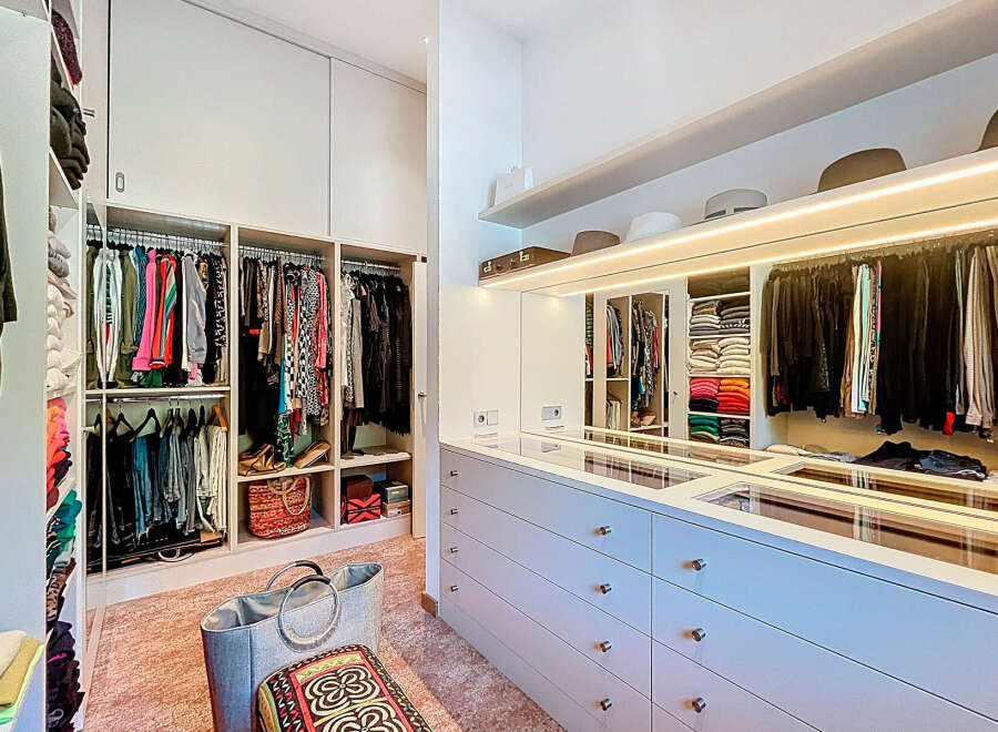 Step into luxury with this stunning walk-in closet, designed to elevate your storage and organization.